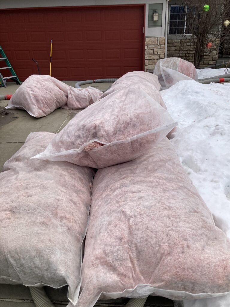 Construction crew rebuilding a fire-damaged home in Denver